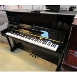 Yamaha (c2007) A Model YM5 upright piano in a bright ebonised case.