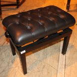 Piano Stool A concert adjustable duet stool with button upholstered leather top.
