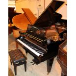Bechstein (c1924) A 5ft 10in Model M grand piano in a satin ebonised case on square tapered legs.