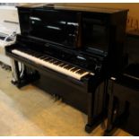 Yamaha (c2005) A Model U5 upright piano in a bright ebonised case.