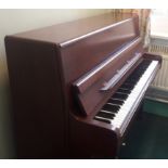 Welmar (c1980) An upright piano in a mahogany case.