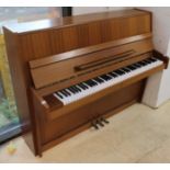 Ronisch (c1985) An upright piano in a modern style satin mahogany case.
