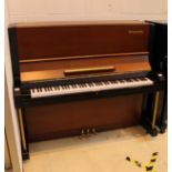 Yamaha (c1962) A Model U3B upright piano in a black satin case with brown keyboard supports.