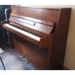 Chappell (c1970’s) An upright piano in a mahogany case.