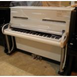 Robertson An upright piano in a white case.