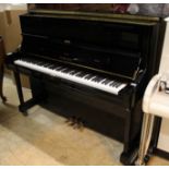 Yamaha (c2005) A Model U1 upright piano in a bright ebonised case.