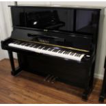 Yamaha (c1981) A 131cm Model YUX upright piano in a bright ebonised case.