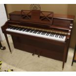 Knight (c1972) An upright piano in a colonial style mahogany case.