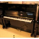 Yamaha (c1963) A Model U2B upright piano in a bright ebonised case.