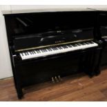 Kawai (c1960) A Model K-8 upright piano in a bright ebonised case.