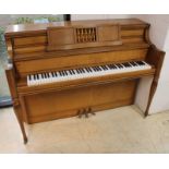 Yamaha (c1971) An upright piano in an American 'spinet' style case; together with a matching stool.