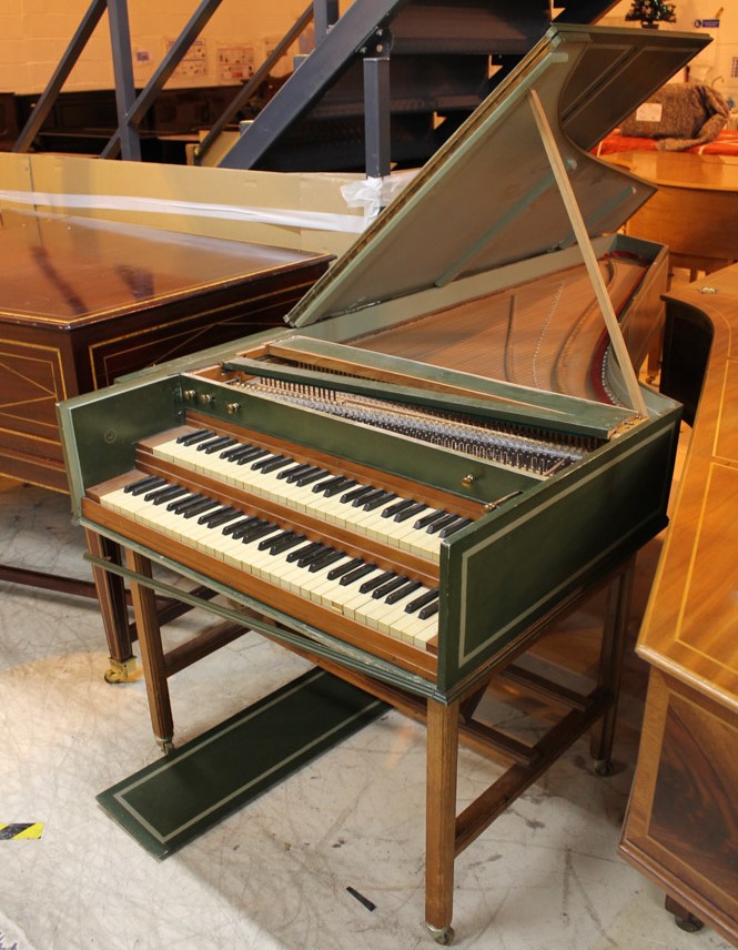 Double Manual Harpsichord A Double manual harpsichord in a green painted case on a trestle base.