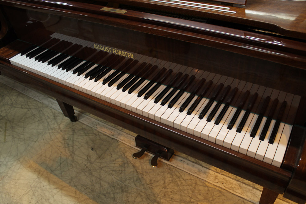 August Förster (c1986) A 5ft 7in grand piano in a bright mahogany case on square tapered legs; - Image 4 of 5