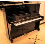 Kawai (c1973) A Model BL61 132cm upright piano in a bright ebonised case.