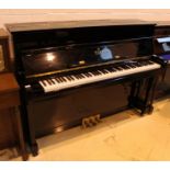 Essex (c2000) AMENDMENT (c2002) A Model 118 upright piano in a bright ebonised case;