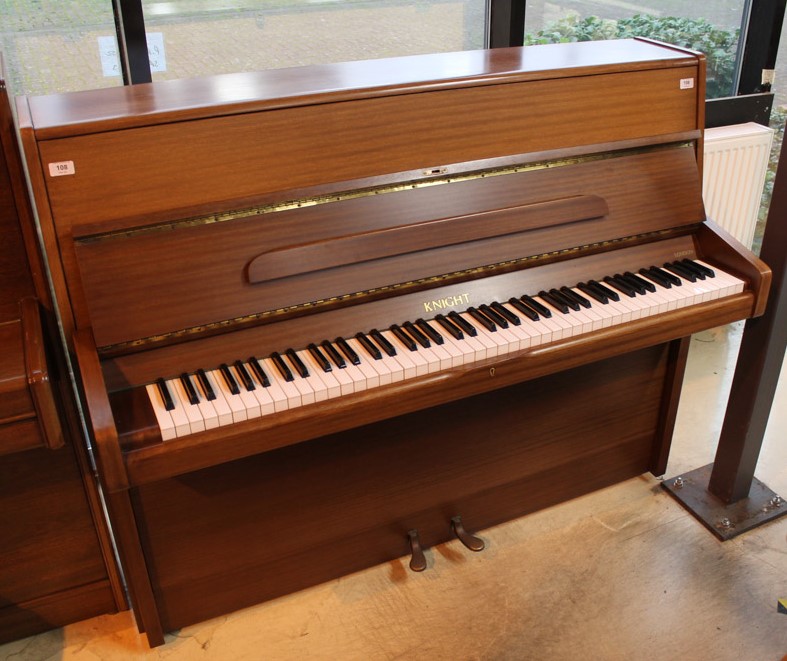 Knight (c1980) An upright piano in a modern style mahogany case