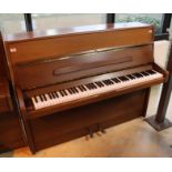 Knight (c1980) An upright piano in a modern style mahogany case