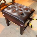 Piano Stool A mahogany concert adjustable stool with button upholstered leather top.