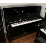 Miki A 121cm Model MU1D upright piano in a bright ebonised case.