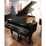 Steinway (c1974) A 6ft 11in Model B grand piano in a bright ebonised case on square tapered legs;
