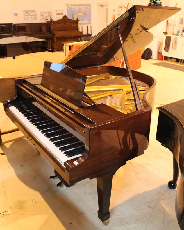 Blüthner (c1984) A 5ft 1in Model 11 grand piano in a bright mahogany case on square tapered legs.