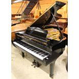 Yamaha (c1972) A 6ft 7in Model G5 grand piano in a bright ebonised case on square tapered legs.