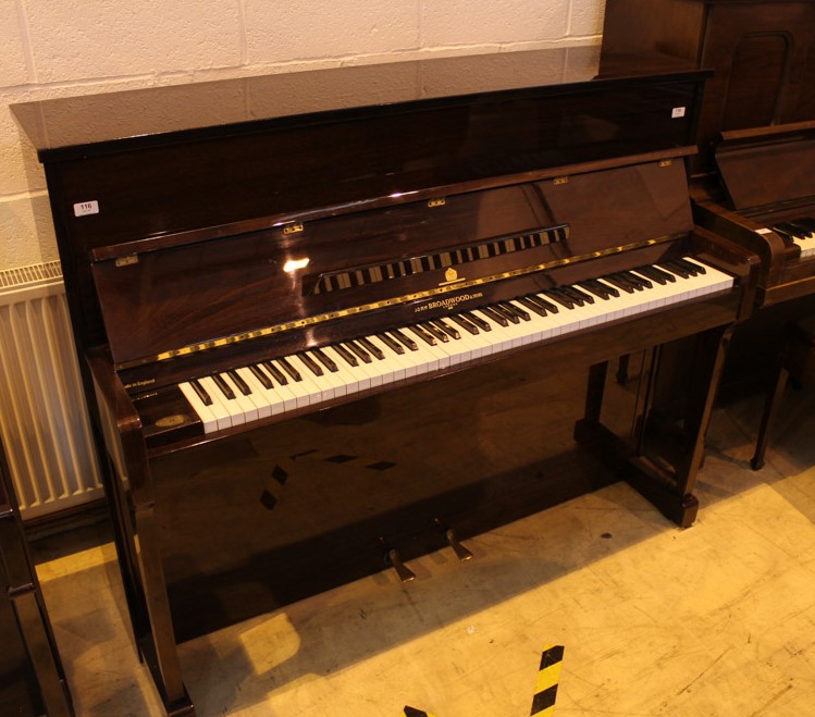 Broadwood (c1988) An upright piano in a traditional style mahogany case.