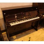 Broadwood (c1988) An upright piano in a traditional style mahogany case.