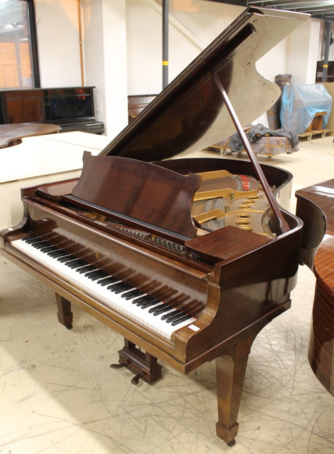 Steinway (c1929) A 5ft 7in Model M grand piano in a mahogany case on square tapered legs.