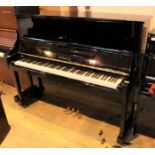 Yamaha (c1988) A Model U10BL upright piano in a bright ebonised case.