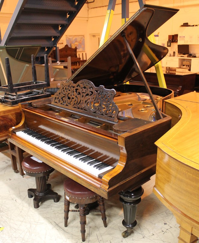 Blüthner (c1898) A 6ft 3in grand piano in a rosewood case on turned legs; together with 2 stools.
