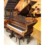 Blüthner (c1898) A 6ft 3in grand piano in a rosewood case on turned legs; together with 2 stools.