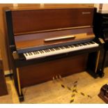 Yamaha (c1958) A Model U3B upright piano in a brown and black satin case.