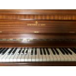 Steinway (c1976) A Model V upright piano in a modern style mahogany case.