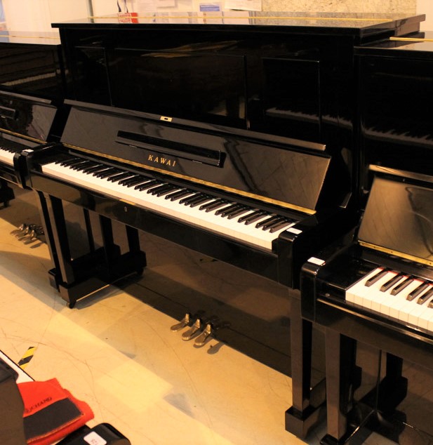 Kawai (c1967) A Model K-35 upright piano in a bright ebonised case.