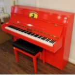 Upright Piano A recent upright piano in a modern style case decorated in the red Ferrari livery.