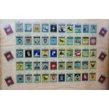 A framed set of 50 tin 'Whitbread Inn Signs' cards,