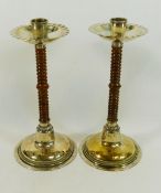 A pair of turned wood and silver plated WMF candlesticks, the collars with manufacturers mark,