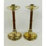 A pair of turned wood and silver plated WMF candlesticks, the collars with manufacturers mark,