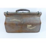 Three items of vintage leather luggage comprised of a Gladstone bag,