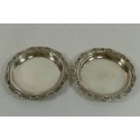 A pair of small Japanese silver coloured metal circular dishes, by K Uyeda,