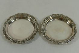 A pair of small Japanese silver coloured metal circular dishes, by K Uyeda,