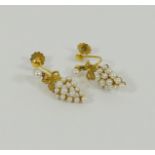 A pair of 9 carat gold seed pearl and yellow metal earrings, with screw backs, London 2004, 2.