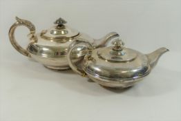 A silver William IV teapot, of squat circular form, raised on circular foot, London 1831,