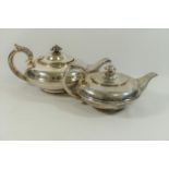 A silver William IV teapot, of squat circular form, raised on circular foot, London 1831,