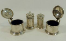 Four silver cruet items, comprised of a two pepperettes and two mustard pots, combined weight 2.