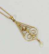 An Edwardian style yellow metal fresh water pearl and diamond openwork pendant, 5cm long,