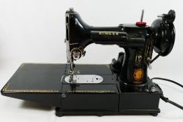 A Singer 222K Electric Sewing Machine, with original box,