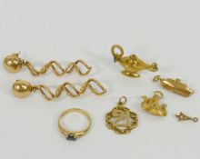 Four 9 carat gold items comprised of three charms and a small gem set ring, 7.