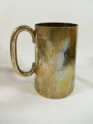A George V silver tankard, with straight sides and 'C' scroll handle,
